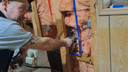 Quarter-Turn Plumbing, Chris completing a pipe repair in Port Alberni home.